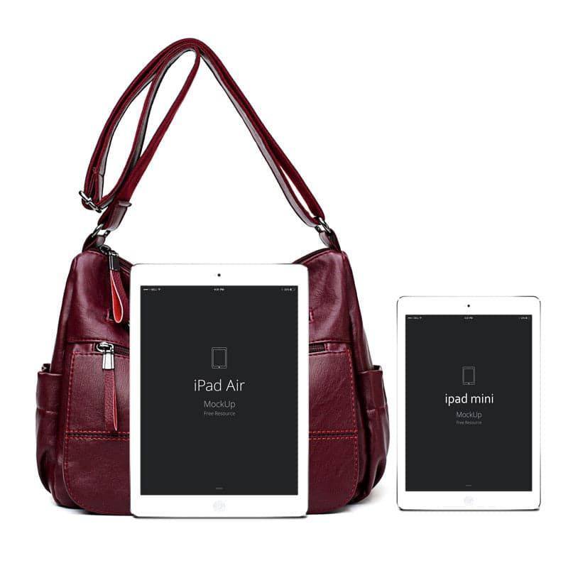 Alt text: Bolsa feminina de couro preto elegante da marca Loox.