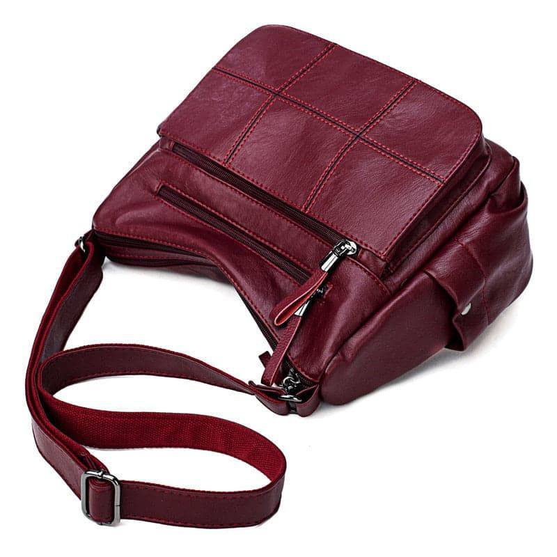 Alt text: Bolsa feminina de couro marrom da marca Loox elegante.