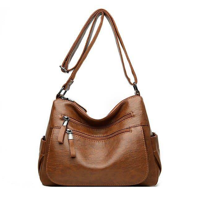 Alt text: Bolsa feminina de couro marrom da marca Loox elegante.