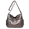 Alt text: Bolsa feminina de couro marrom da marca Loox elegante.