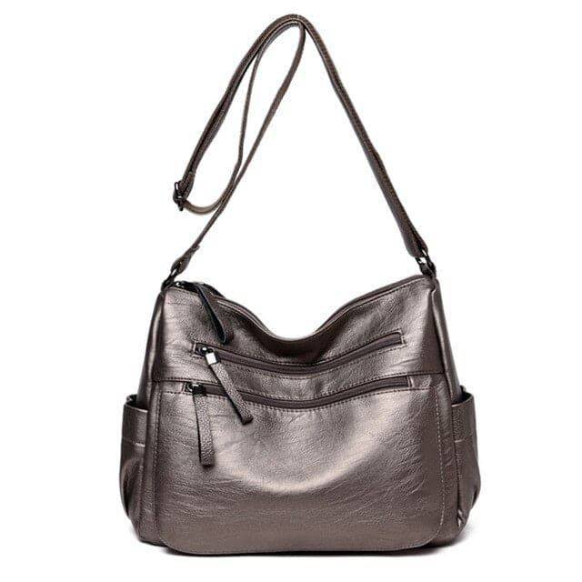 Alt text: Bolsa feminina de couro marrom da marca Loox elegante.