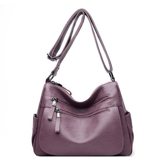 Alt text: Bolsa feminina de couro marrom da marca Loox elegante.