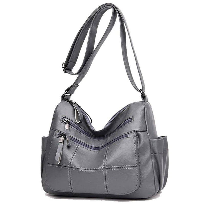 Alt text: Bolsa feminina de couro marrom da marca Loox elegante.