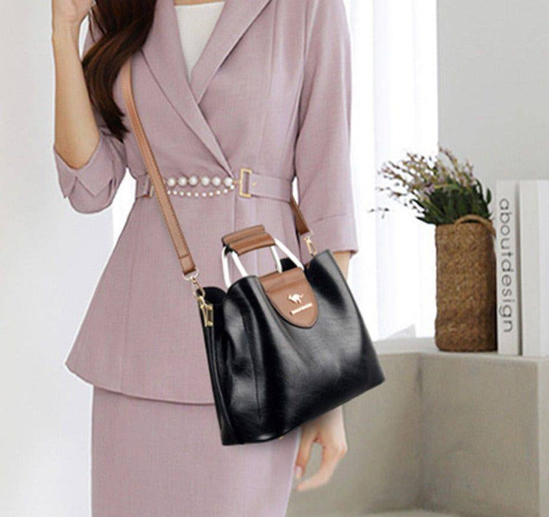 Alt text: Bolsa feminina de couro violeta elegante e sofisticada.