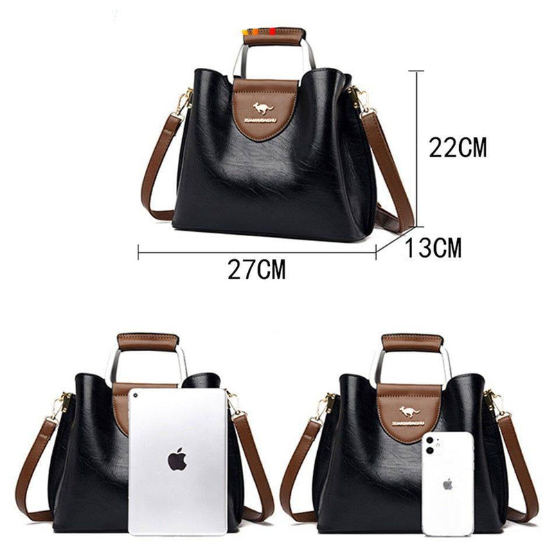 Alt text: Bolsa feminina de couro violeta elegante e sofisticada.