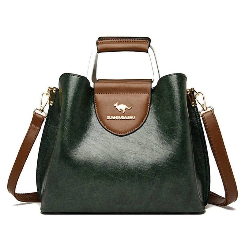 Alt text: Bolsa feminina de couro violet com design elegante e sofisticado.