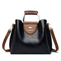 Alt text: Bolsa feminina de couro violeta elegante e sofisticada.