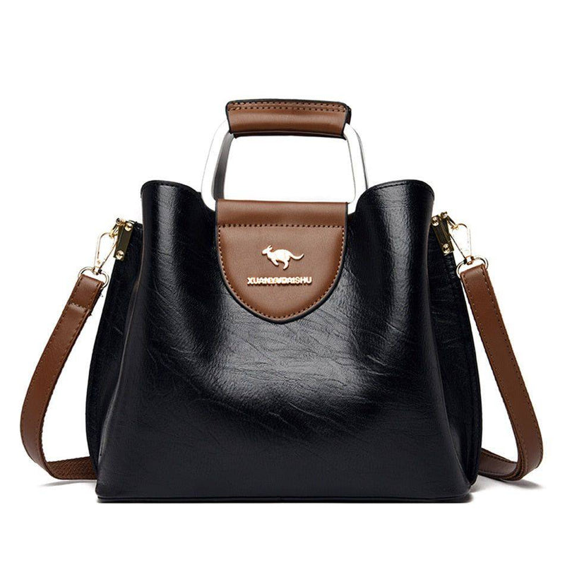 Alt text: Bolsa feminina de couro violeta elegante e sofisticada.