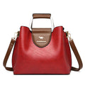 Alt text: Bolsa feminina de couro violet com design elegante e sofisticado.