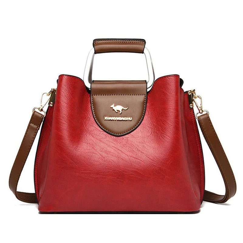 Alt text: Bolsa feminina de couro violet com design elegante e sofisticado.