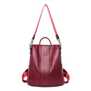 Mochila bolsa feminina de couro vinho com alça de ombro rosa e alças duplas