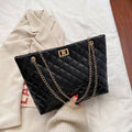 Alt text: Bolsa Tote De Couro Feminina em tom neutro elegante.