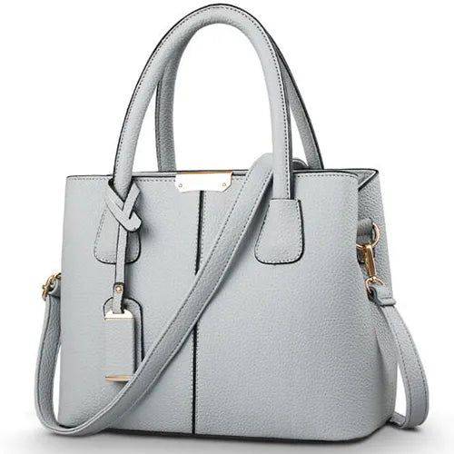Alt text: Bolsa Tote de Couro Feminina Eliza em tom neutro.