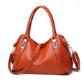 Alt text: Bolsa tiracolo estruturada de couro marrom escuro elegante.