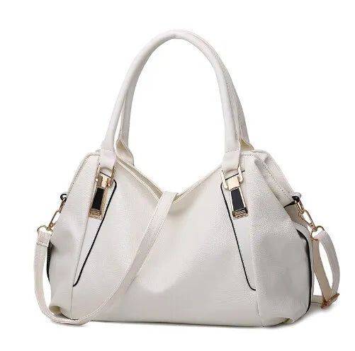 Alt text: Bolsa tiracolo de couro estruturada marrom, elegante e versátil.