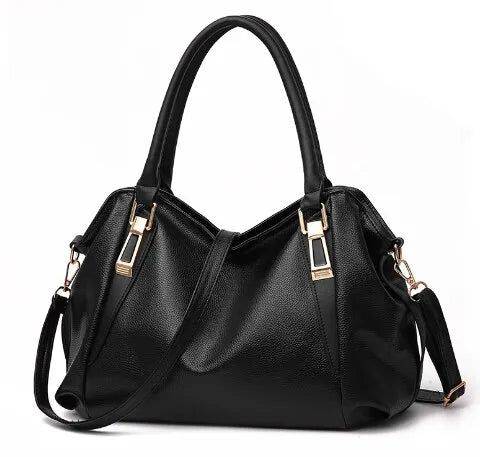 Alt text: Bolsa tiracolo de couro estruturada em tom neutro.