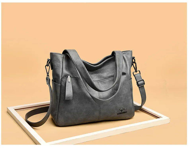Alt text: Bolsa Tote de Couro Feminina Lara em tom neutro.