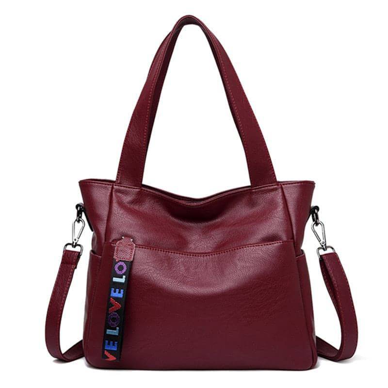 Alt text: Bolsa Tote de Couro Feminina Lara, cor caramelo.