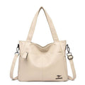 Alt text: Bolsa Tote de Couro Feminina Lara em tom neutro.