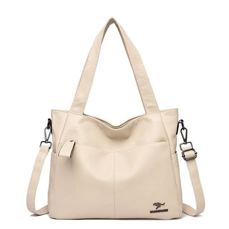 Alt text: Bolsa Tote de Couro Feminina Lara em tom neutro.