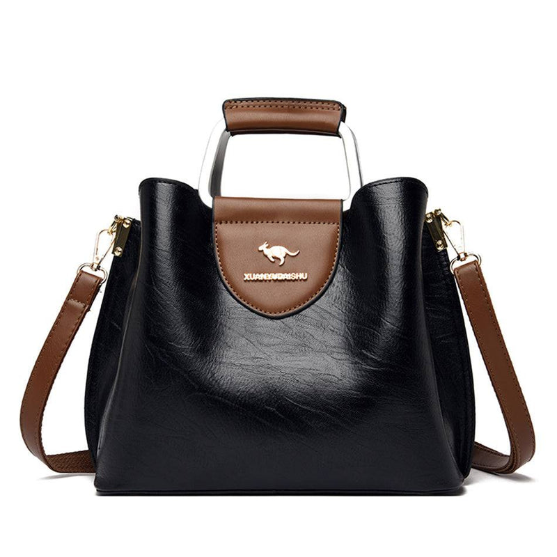 Alt text: Bolsa feminina de couro violeta elegante e sofisticada.