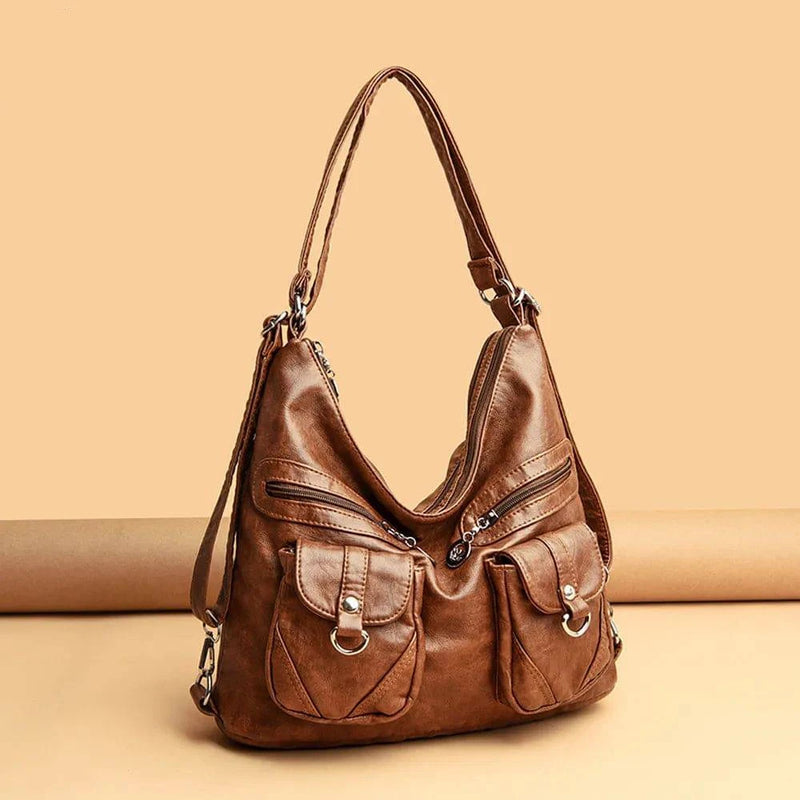 Alt text: Bolsa feminina de couro genuíno na cor preta elegante.