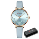 Relógio Curren com mostrador floral, pulseira azul e estojo