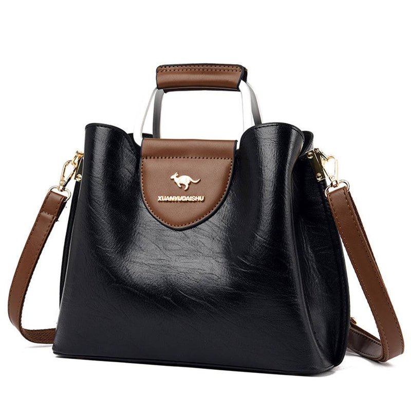 Alt text: Bolsa feminina de couro violet, elegante e espaçosa.
