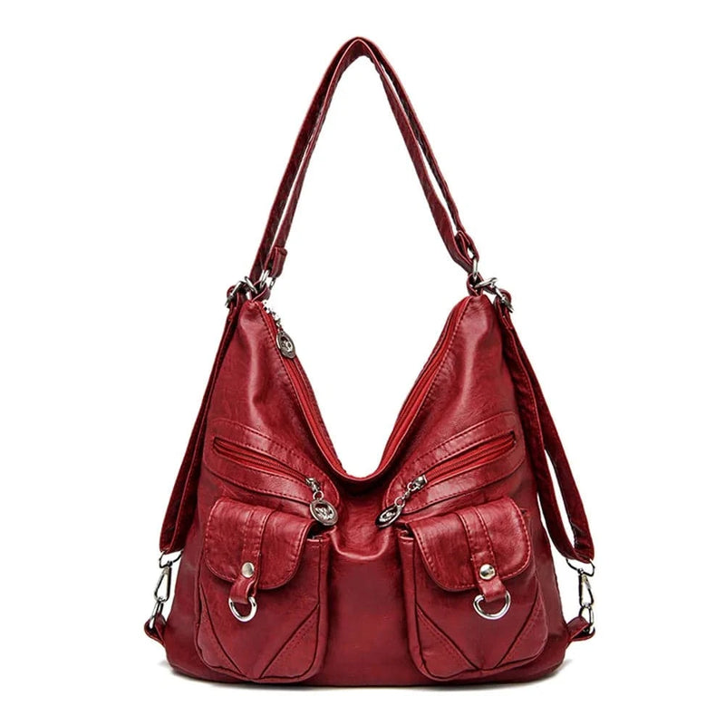 Alt text: Bolsa feminina de couro genuíno na cor marrom elegante.