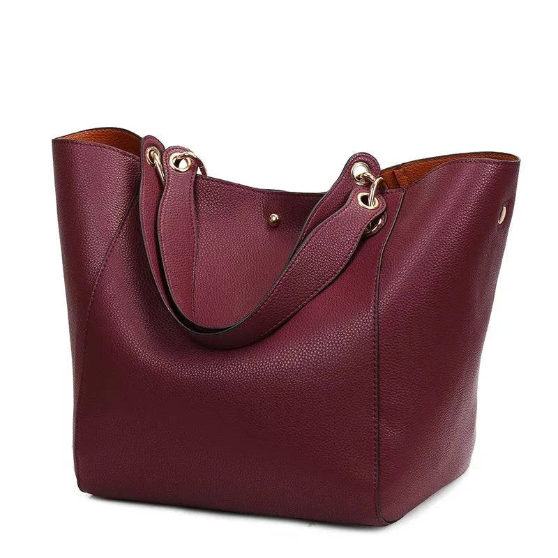"Bolsa feminina de couro Tote Felix em tom neutro."
