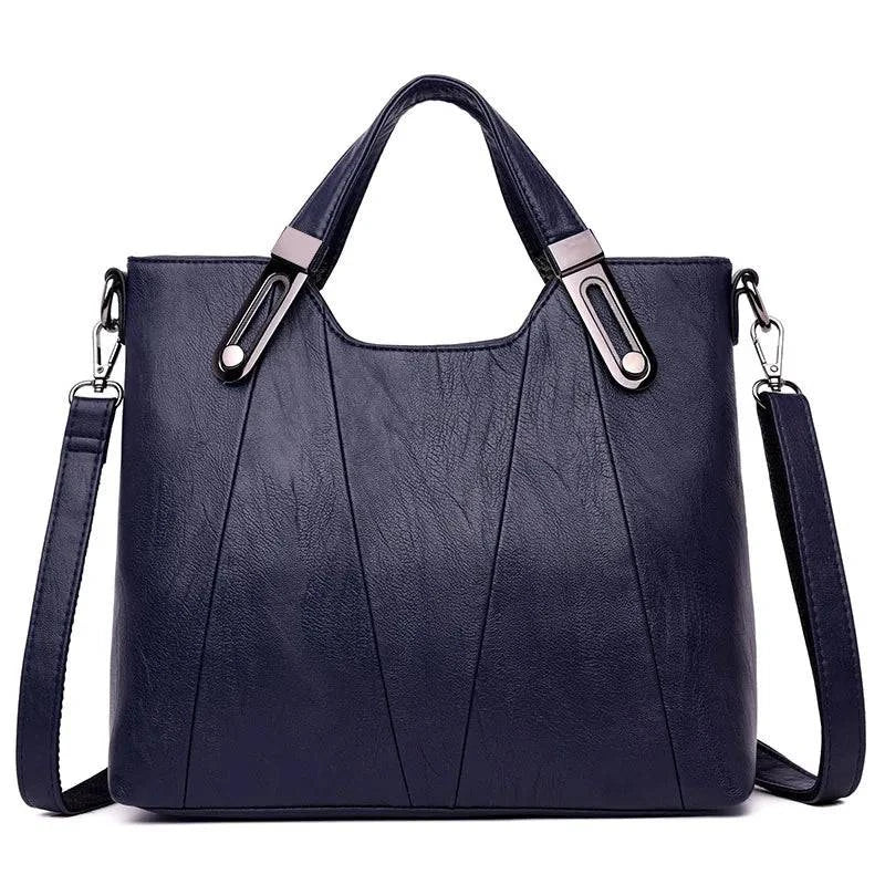 Alt text: Bolsa de Ombro Estruturada em Couro Marrom com Alça Removível.
