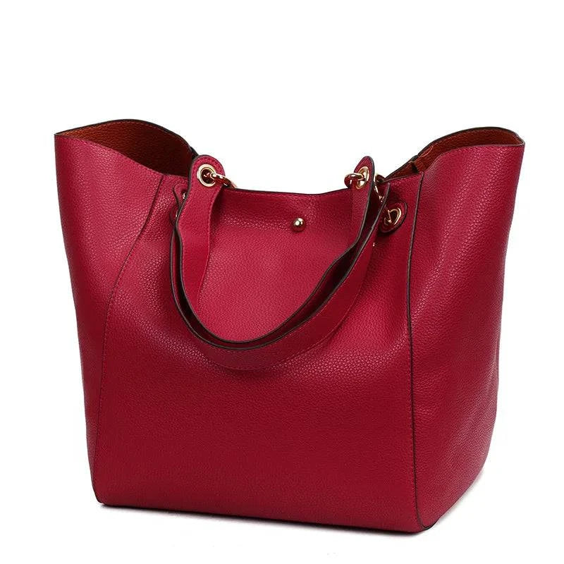 "Bolsa feminina de couro Tote Felix em marrom escuro."