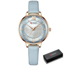 Relógio feminino Curren com mostrador pérola azul claro, caixa rosê-dourado e pulseira couro