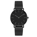 Relógio minimalista preto com pulseira de aço inoxidável mesh