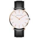 Relógio minimalista feminino com caixa rosê, mostrador branco e pulseira de couro preta