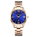 Relógio feminino dourado com mostrador azul, pulseira em aço inoxidável e numerais romanos