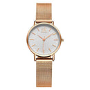 Relógio feminino com mostrador redondo e pulseira de malha dourada rosa
