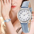 Relógio minimalista com pulseira de couro azul claro e mostrador branco