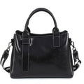 Alt text: Bolsa feminina tote em couro genuíno glam marrom escuro.