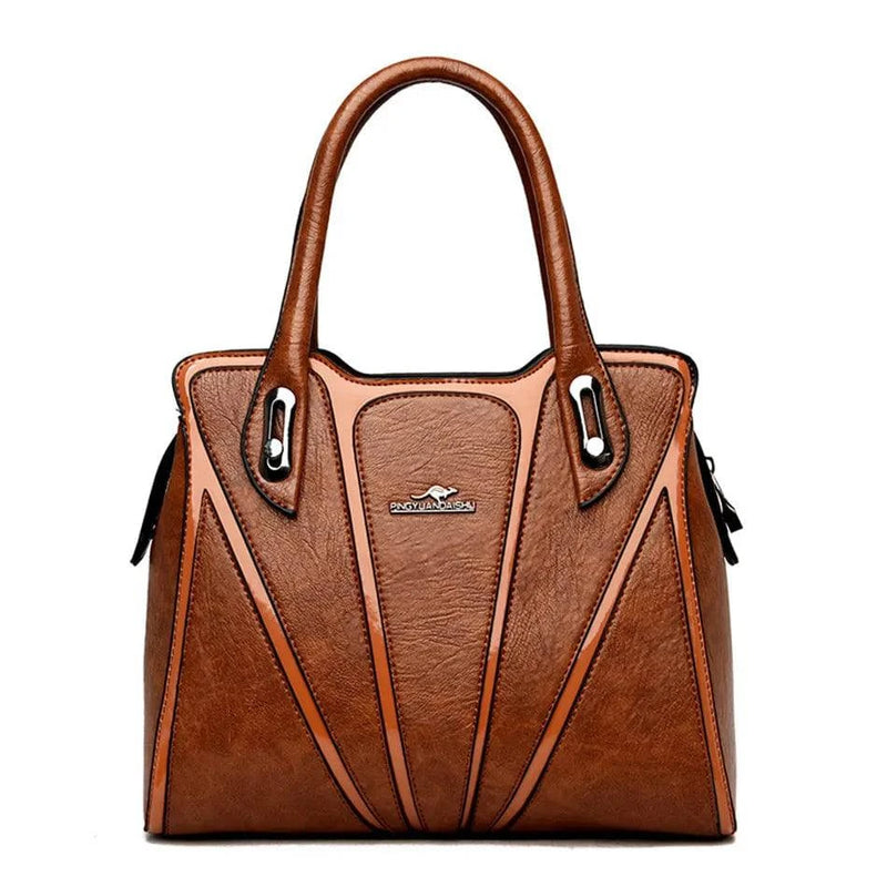 "Bolsa feminina de couro crossbody em tom neutro elegante."