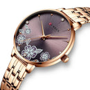 Relógio feminino com mostrador floral e pulseira dourada rosada