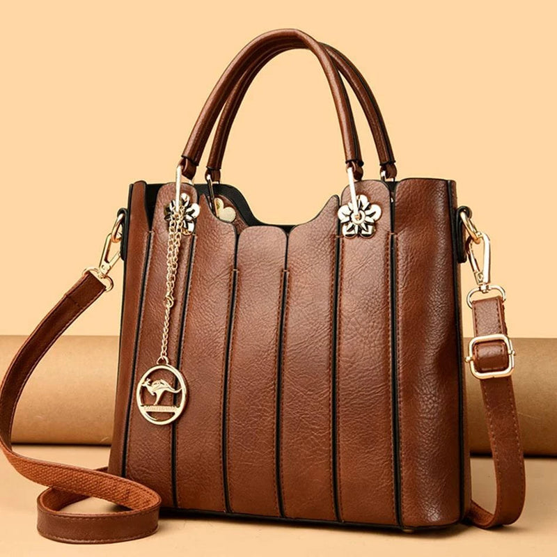 Clássica bolsa tote feminina em couro opale marrom escuro.