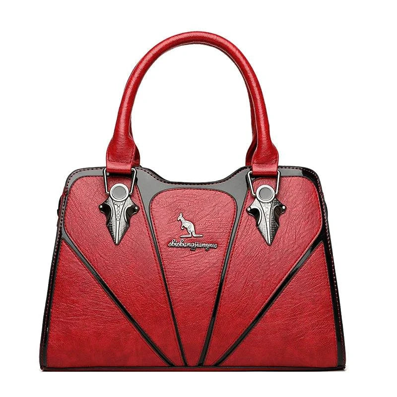 Alt text: Bolsa feminina de couro Monarque em tom marrom elegante.