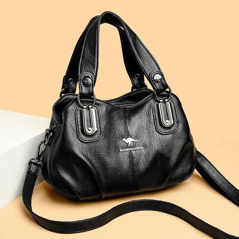 Alt text: Bolsa feminina de couro legítimo preta com alça dupla elegante.