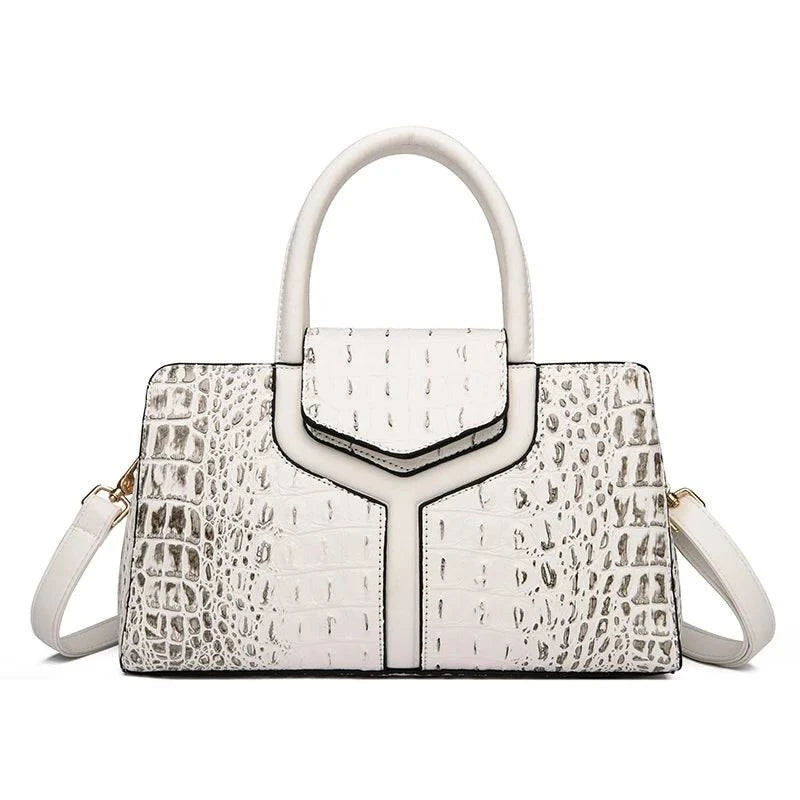 Alt text: Bolsa Satchel Feminina de Couro Elisium em tom neutro.