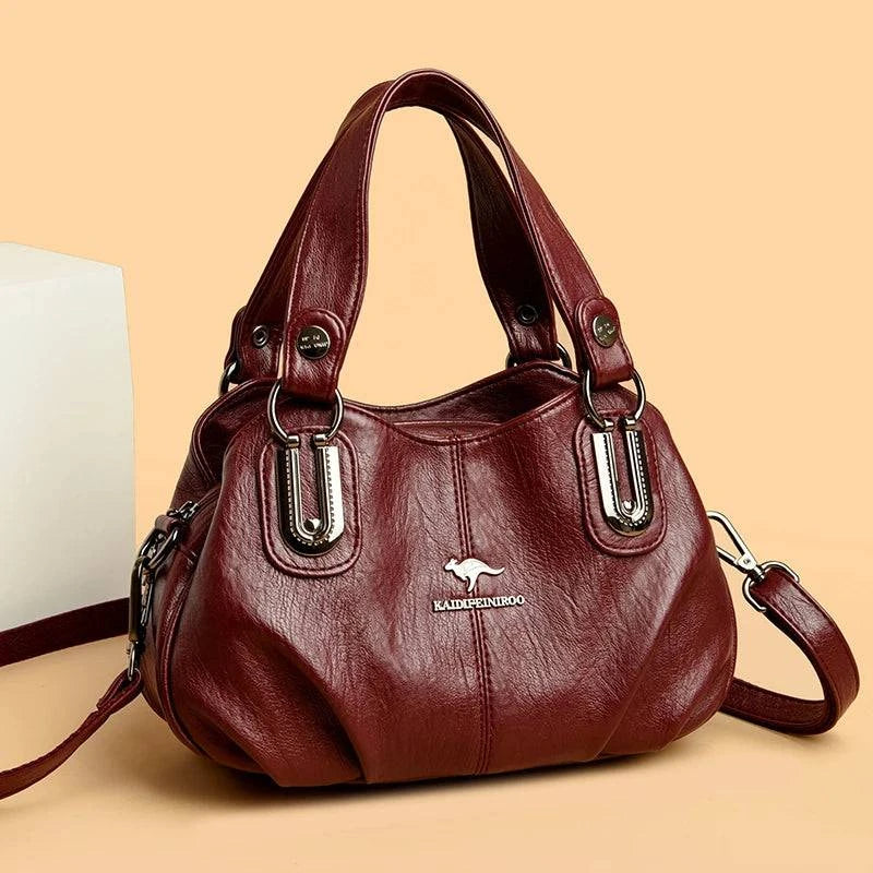 "Bolsa feminina de couro legítimo preto com alça dupla elegante."