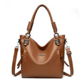 Alt text: Bolsa feminina de couro tote preta com alça dupla elegante.