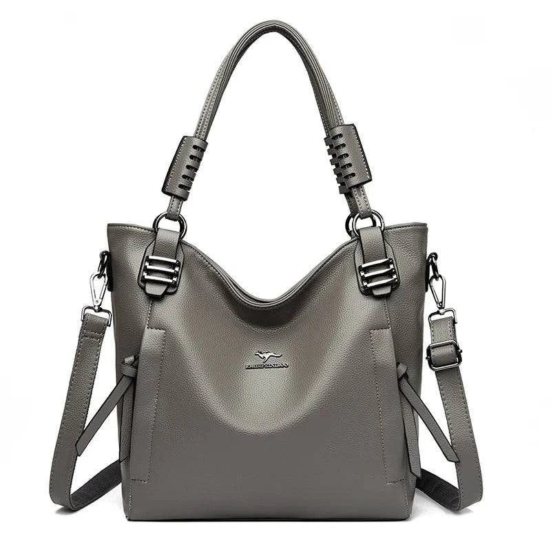 Alt text: Bolsa feminina de couro tote marrom com alça dupla elegante.