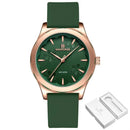 Relógio com caixa rosé, mostrador verde com padrão floral e pulseira de couro