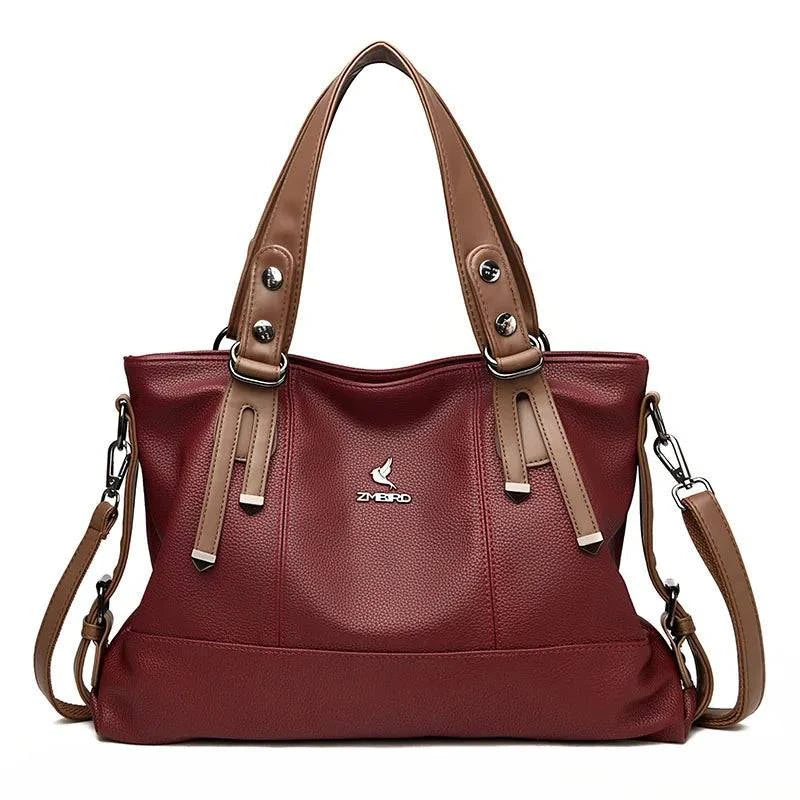"Bolsa feminina de mão em couro genuíno marrom elegante"